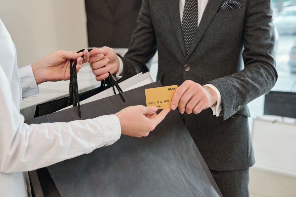 Person paying with her gold card