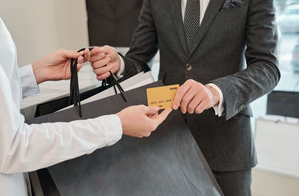 Person paying with her gold card