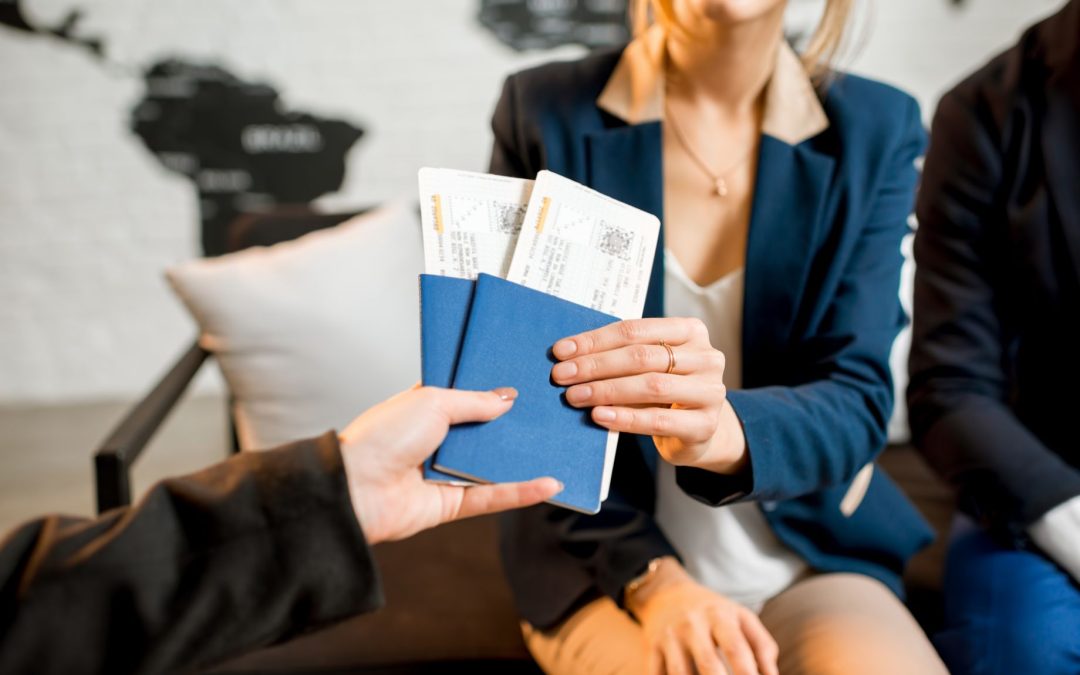 A travel agency giving flight tickets to a couple
