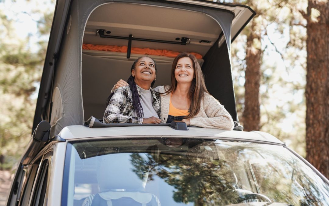 two girls in a camping car, theiy have chosen this travel option